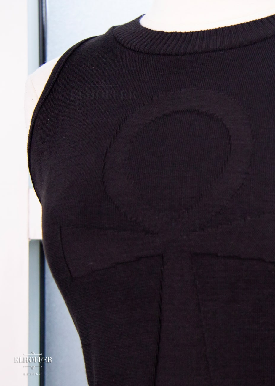 Close up of the ankh design on the front of the crop top.