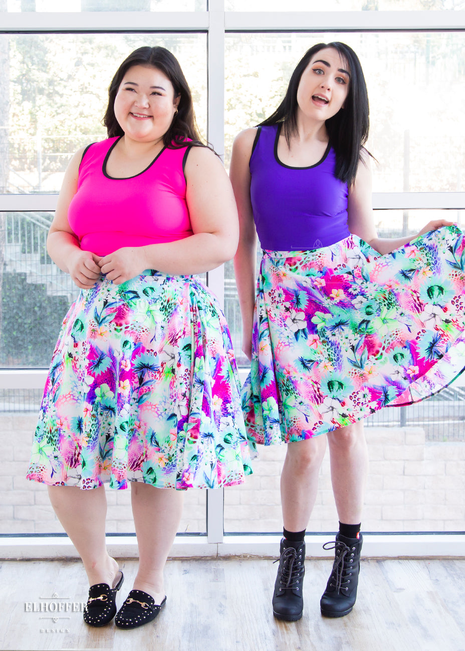 Ashley and Amy both wearing our rainbow jungle skirt and buffy crops.