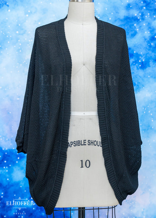 Black cardigan on a mannequin against a blue background with 'Elhoffer' branding.