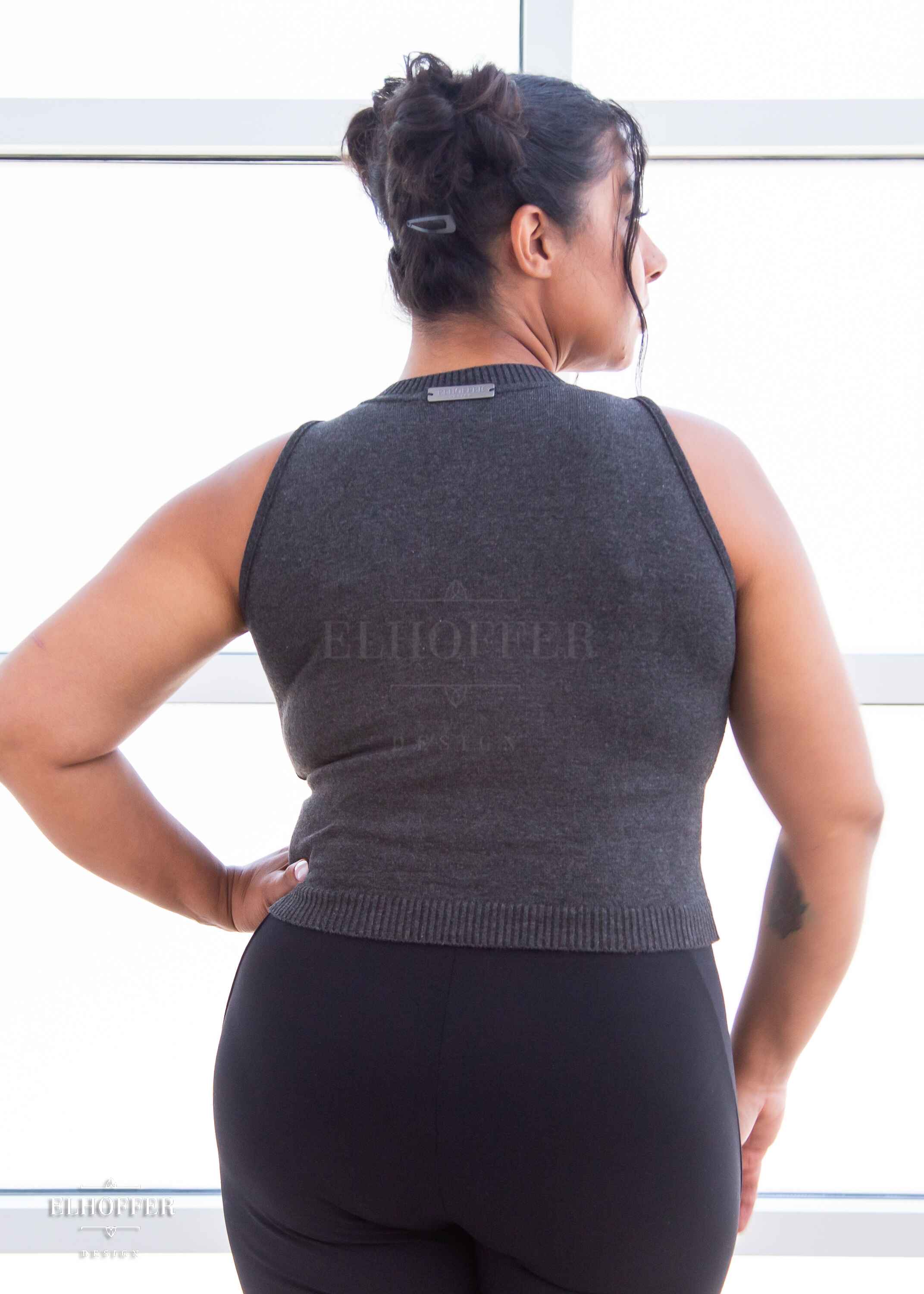 Janae is modeling the Production L. She has a 40” Bust, 35” Waist, 43” Hips, and is 5’7”.