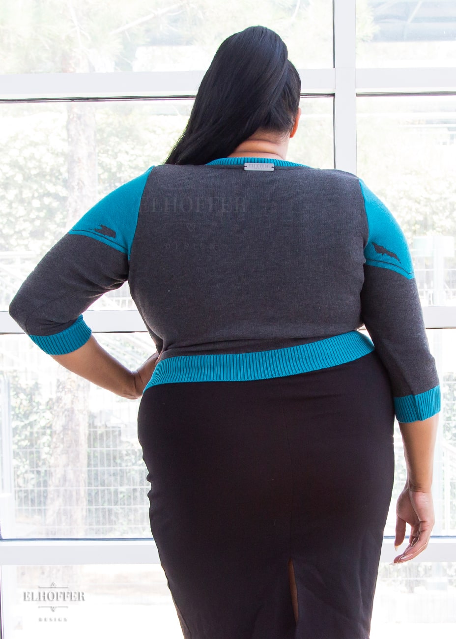 Tas is modeling the Production 2XL. She has a 51” Bust, 39.5” Waist, 52” Hips, and is 5’6”.