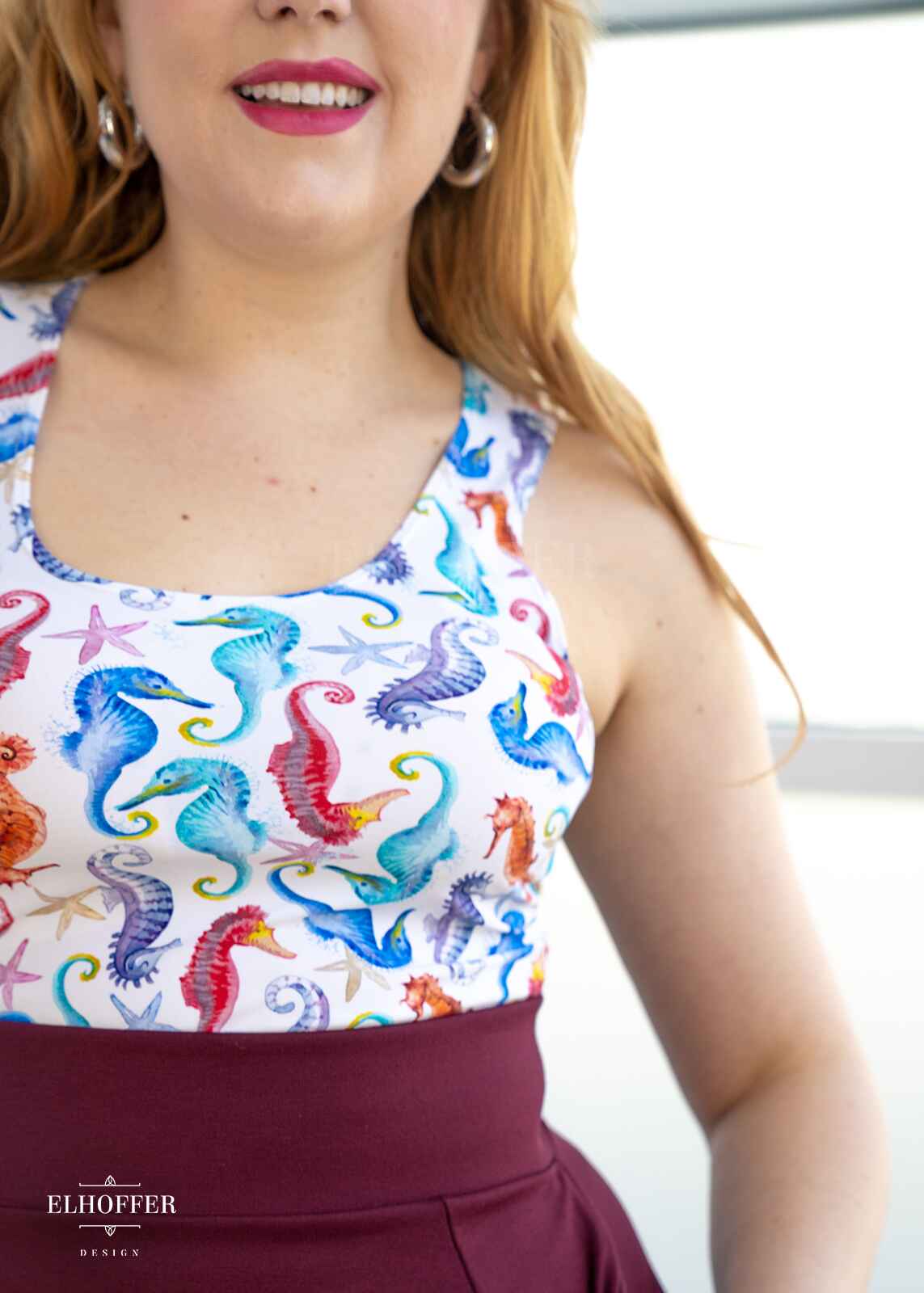 A close up of seahorse patten on the crop top.