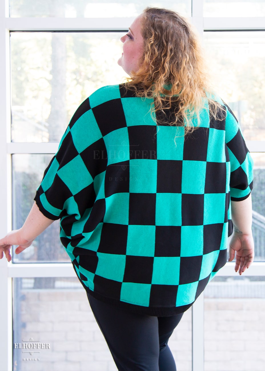 Bee is modeling the Sample XL-3XL. She has a 56” Chest, 53.5” Waist, 61” Hips, and is 5’8.