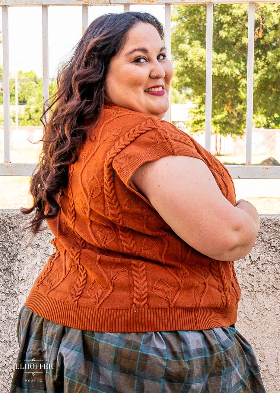 Alysia is modeling the Production L (3XL-4XL). She has a 52” Chest, 46” Waist, 55” Hips, and is 5’4”. She generally wears a 2XL in our pieces.
