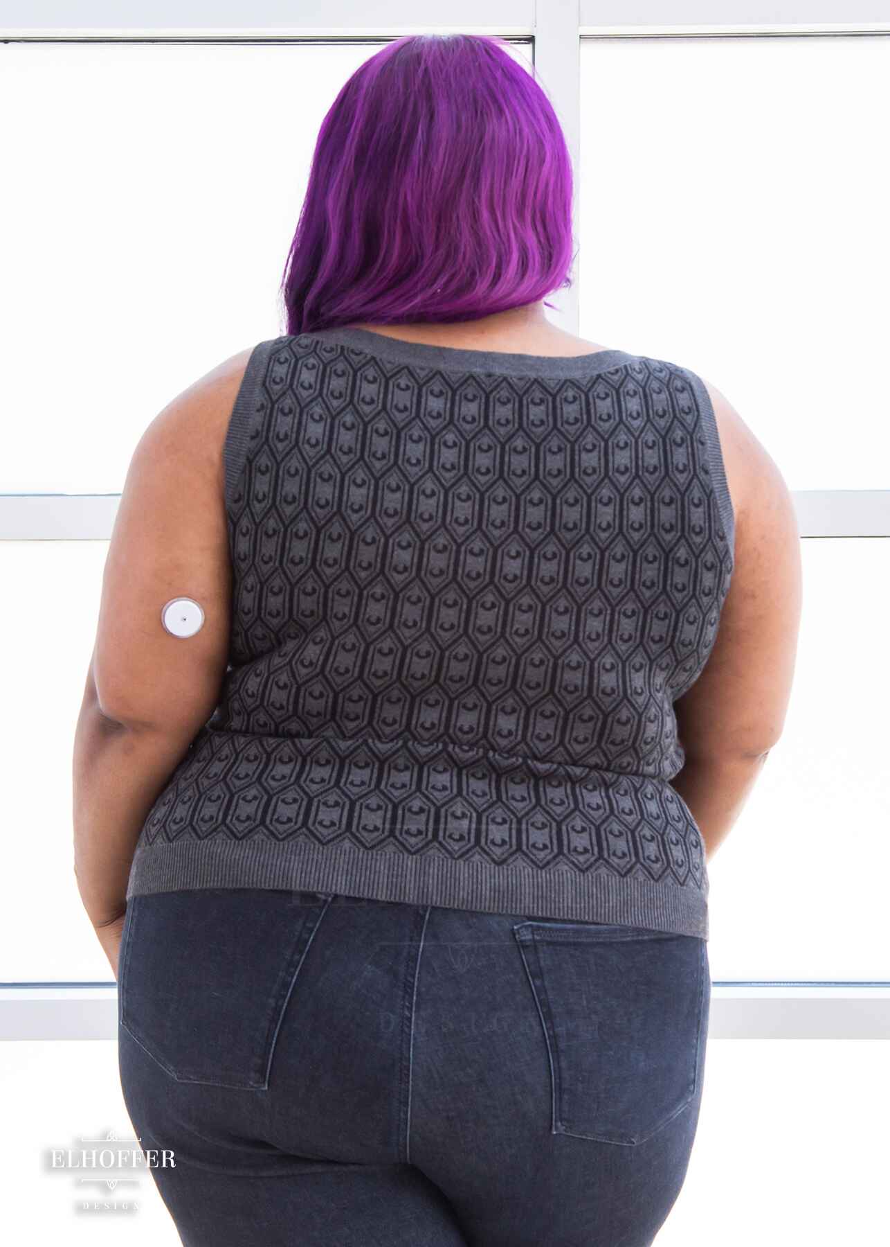 Jade is modeling the Production 2XL. She has a 52” Chest, 41.” Waist, 54” Hips and is 5’4”.
