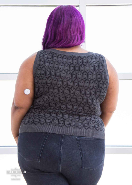 Jade is modeling the Production 2XL. She has a 52” Chest, 41.” Waist, 54” Hips and is 5’4”.