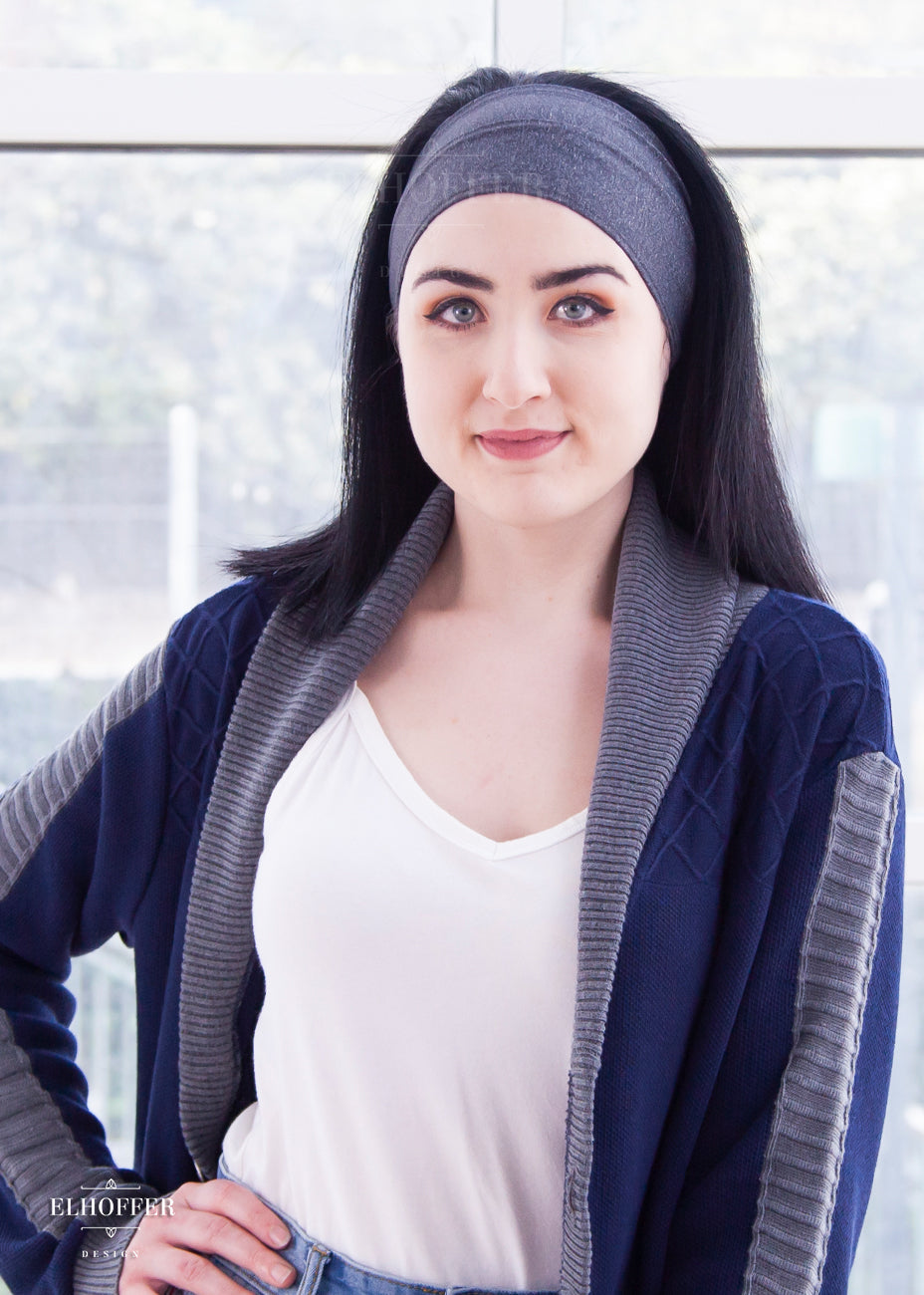 A heathered charcoal grey headband with hemmed edges. The headband is around 3" at the top and gradually gets smaller as it goes around the head.