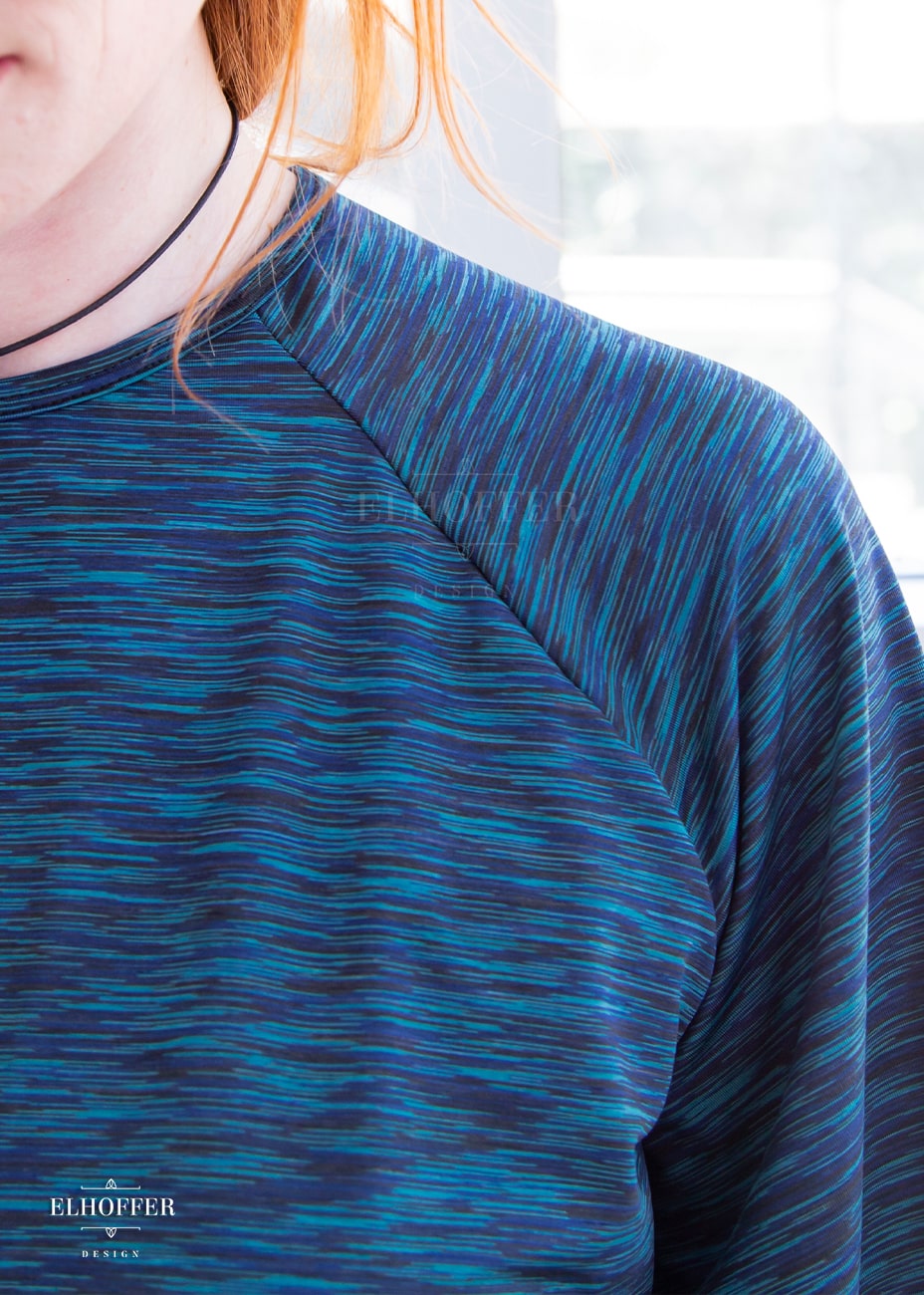 Detail shot of the pattern of the blue fabric.
