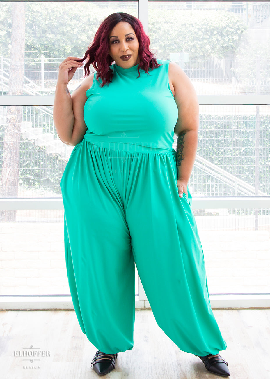 Dawn models the mock turtle neck sleeveless mint green crop top with matching harem style long pants with a fitted waistband and cuffs and flowy fabric.