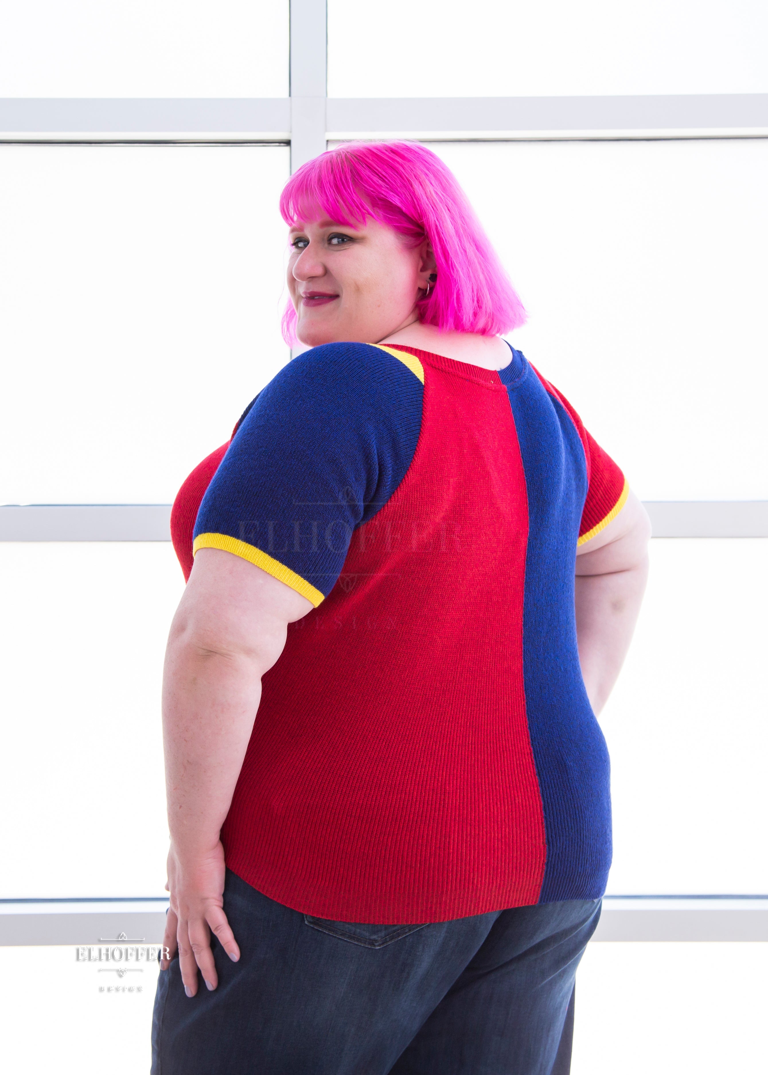 Logan is modeling the Production 3XL. She has a 54.5” Chest, 50” Waist, 62” hips, and is 5’7”.
